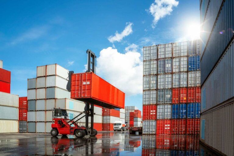crane-car-move-carry-container-box-from-container-stack-loading-truck-container-box-deposit-conpany-this-image-can-use-business-logitic-import-export-concept-scaled-min